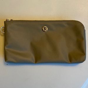 Lulu lemon wristlet in olive green. NWOT.